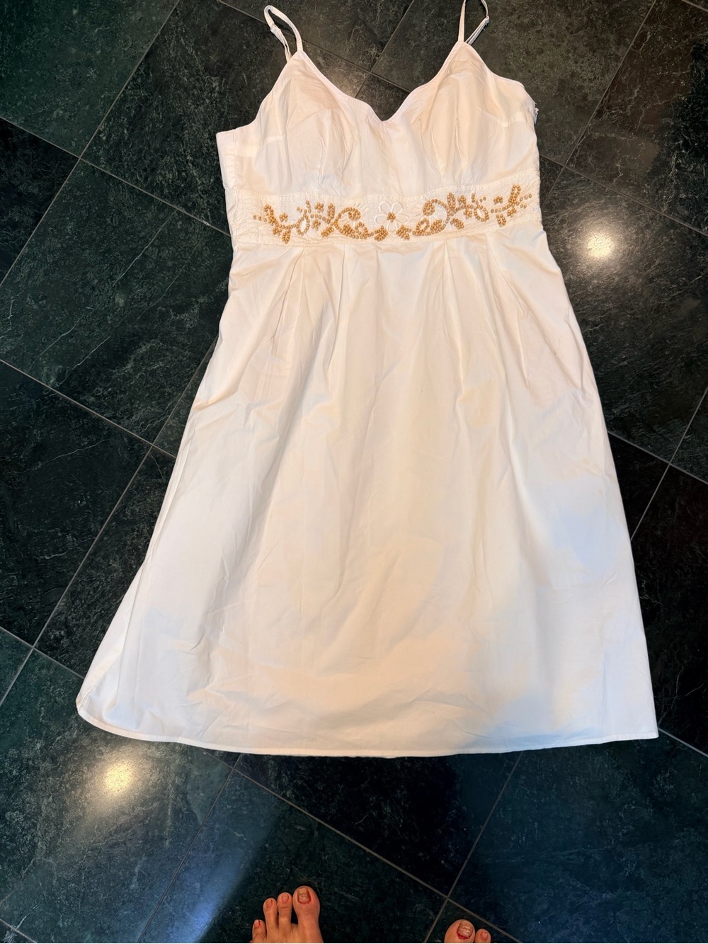White  cotton dress with beautiful bead work.